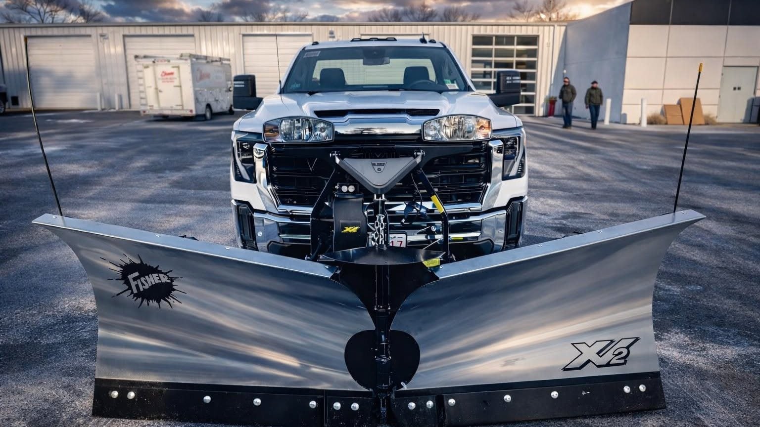 GMC Sierra 2500HD with a Fisher XV2 stainless steel v-plow installed, in front of Marty's GMC in Kingston, MA